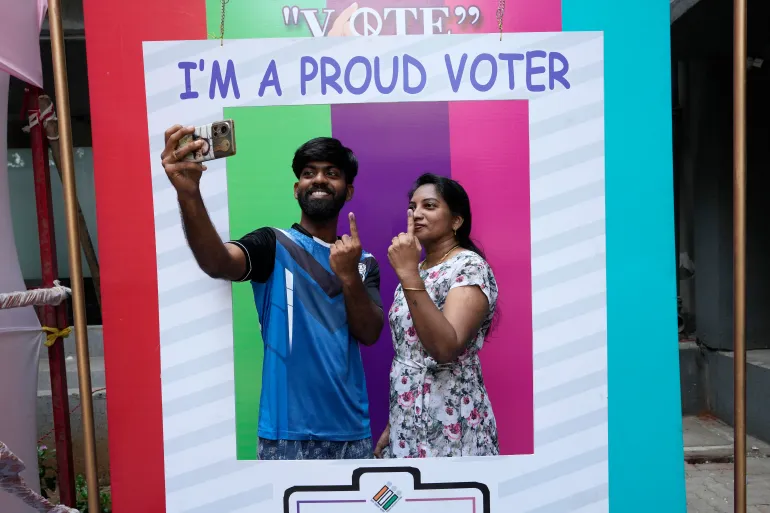 A couple takes a selfie after casting their votes in a polling station during the fifth round of the multiphase national elections in Mumbai [Rajanish Kakade/AP Photo take from AlZajeera]